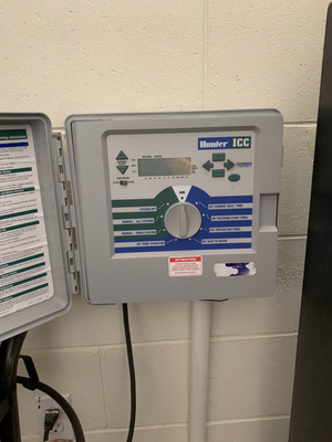 Irrigation controller mounted on a garage wall